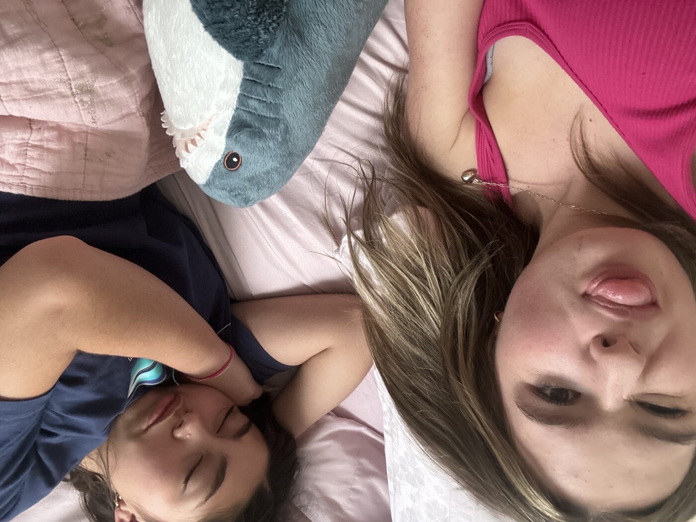 Alona pulling a face while Tess naps